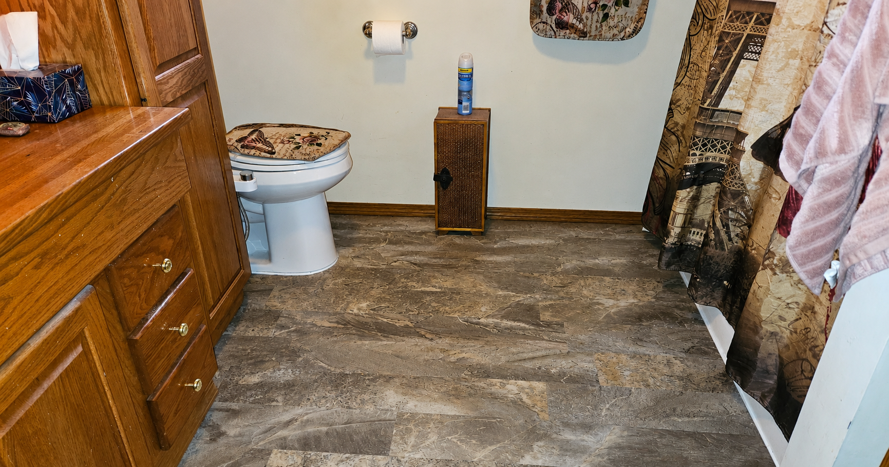 Completed laminate flooring installation in a bathroom in Troy Montana